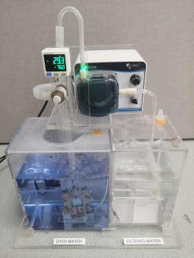 Figure 2. Prototype of vacuum-driven nanofiltration showing the efficient purification of dyed water (Credit: Mr. Bowen Gan)